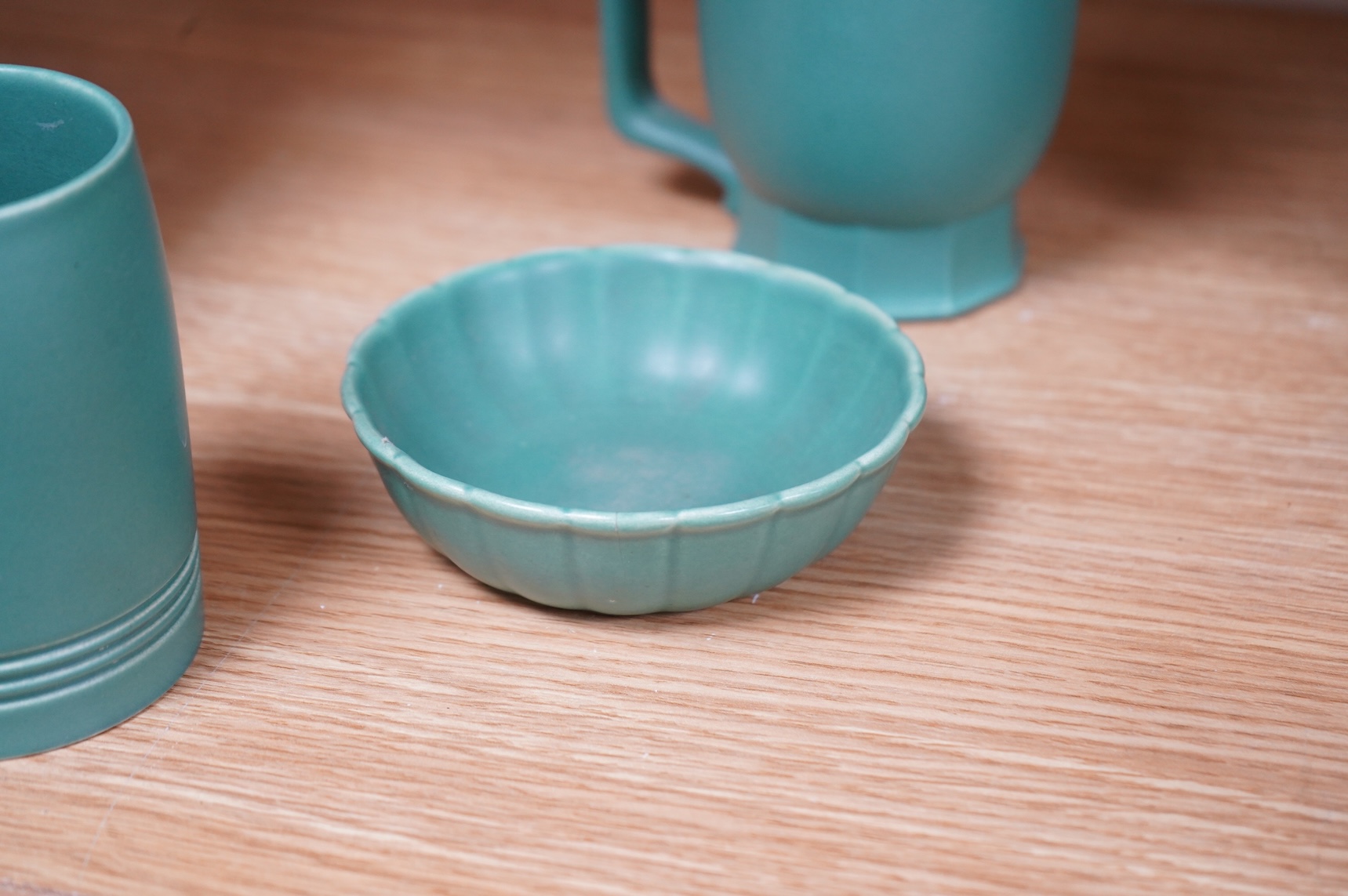 Keith Murray for Wedgwood, three green mugs, cigarette box, fluted dish and small vase, largest 12cm high (6)